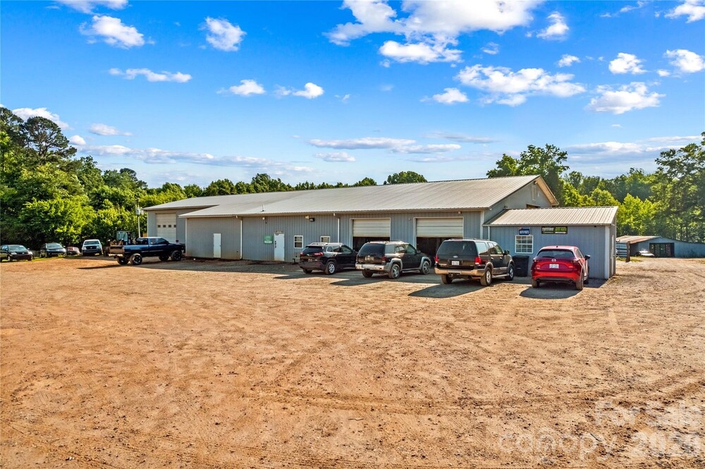 29 Car Garage in a Commercial Setting and it has a House that you Can Live-in!