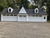 Five Car Garage Is A Dream Come True For The Car Enthusiast.