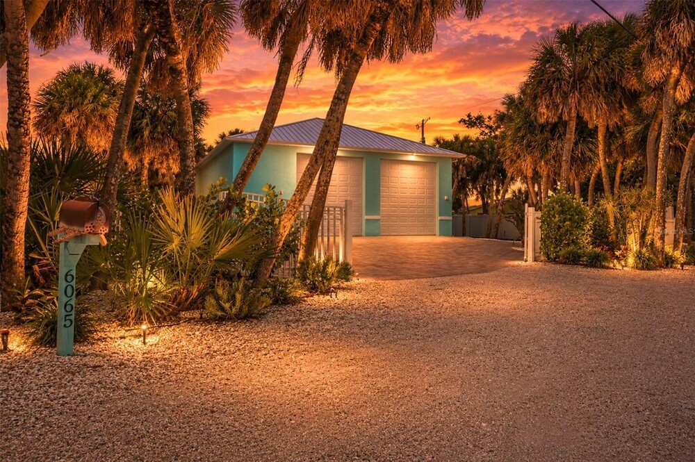 Waterfront Luxury Meets Unmatched Garage Space on the Highly Desirable Manasota Key