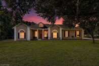 Priced right and it has an 8 Car Garage, Separate Apartment and 1.03 Acres to Live and Play.