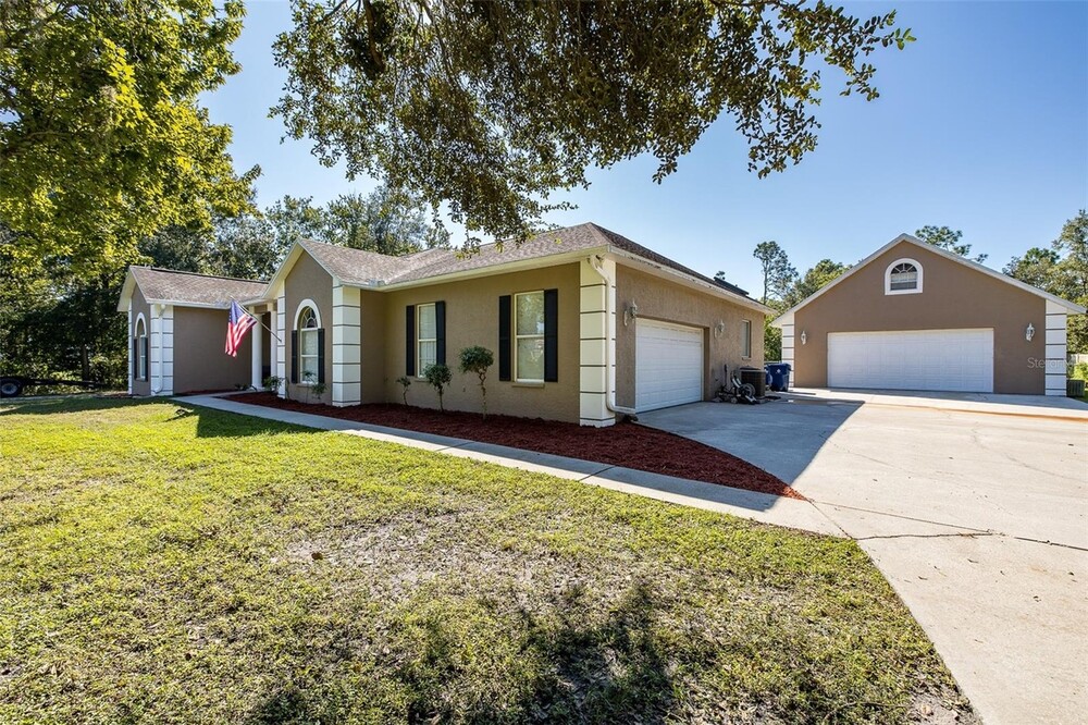 Priced right and it has an 8 Car Garage, Separate Apartment and 1.03 Acres to Live and Play.