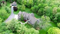 10 plus Car Garage Space with this 10 Acre Estate