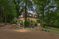 Tranquil Retreat: Wraparound Porch, 6-Car Garage, Private Cabi