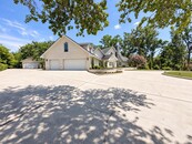 Car Enthusiasts, Collectors, and those needing Additional Storage will appreciate the Impressive Five-Car Garage