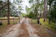 This 8 Car Garage House with 2 RV Roll Up Doors on 7.74 Acres Can Be Yours